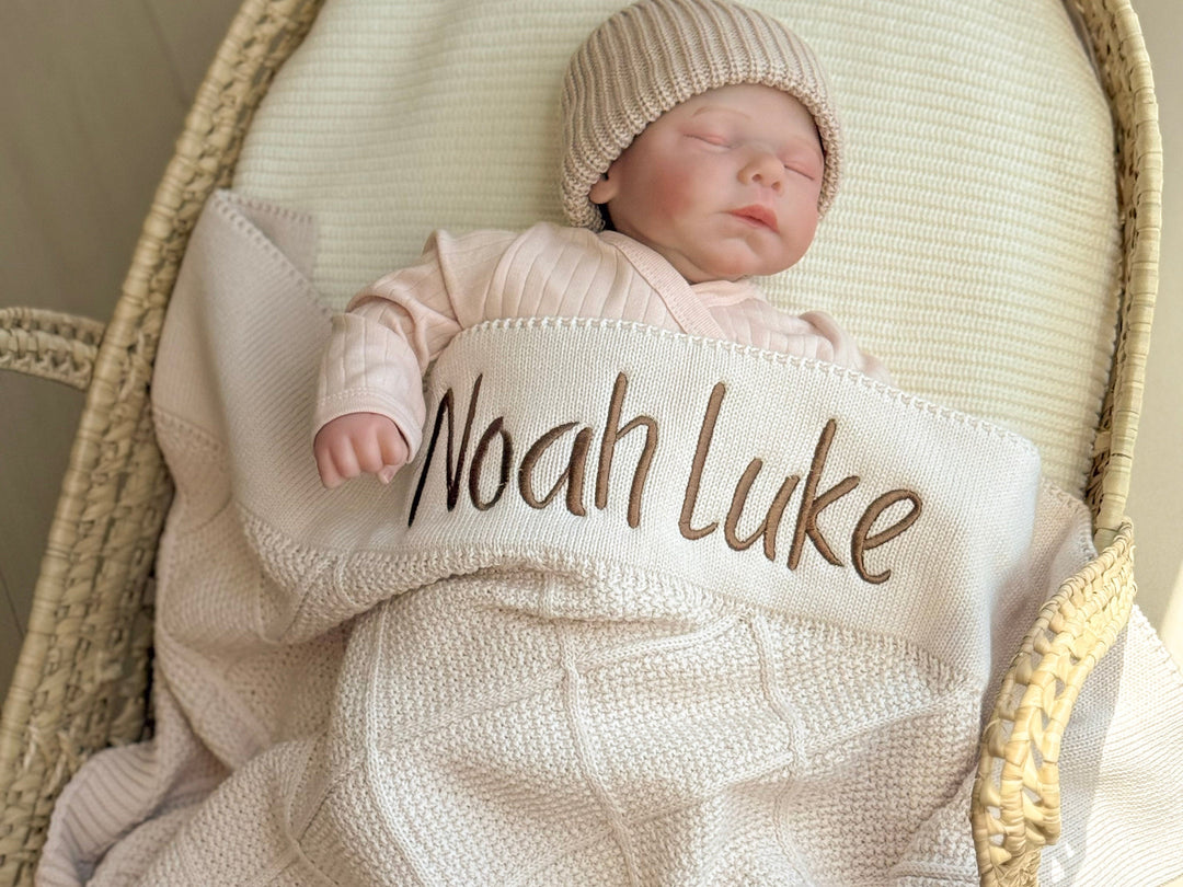 toddler sleeping with personalized baby blanket