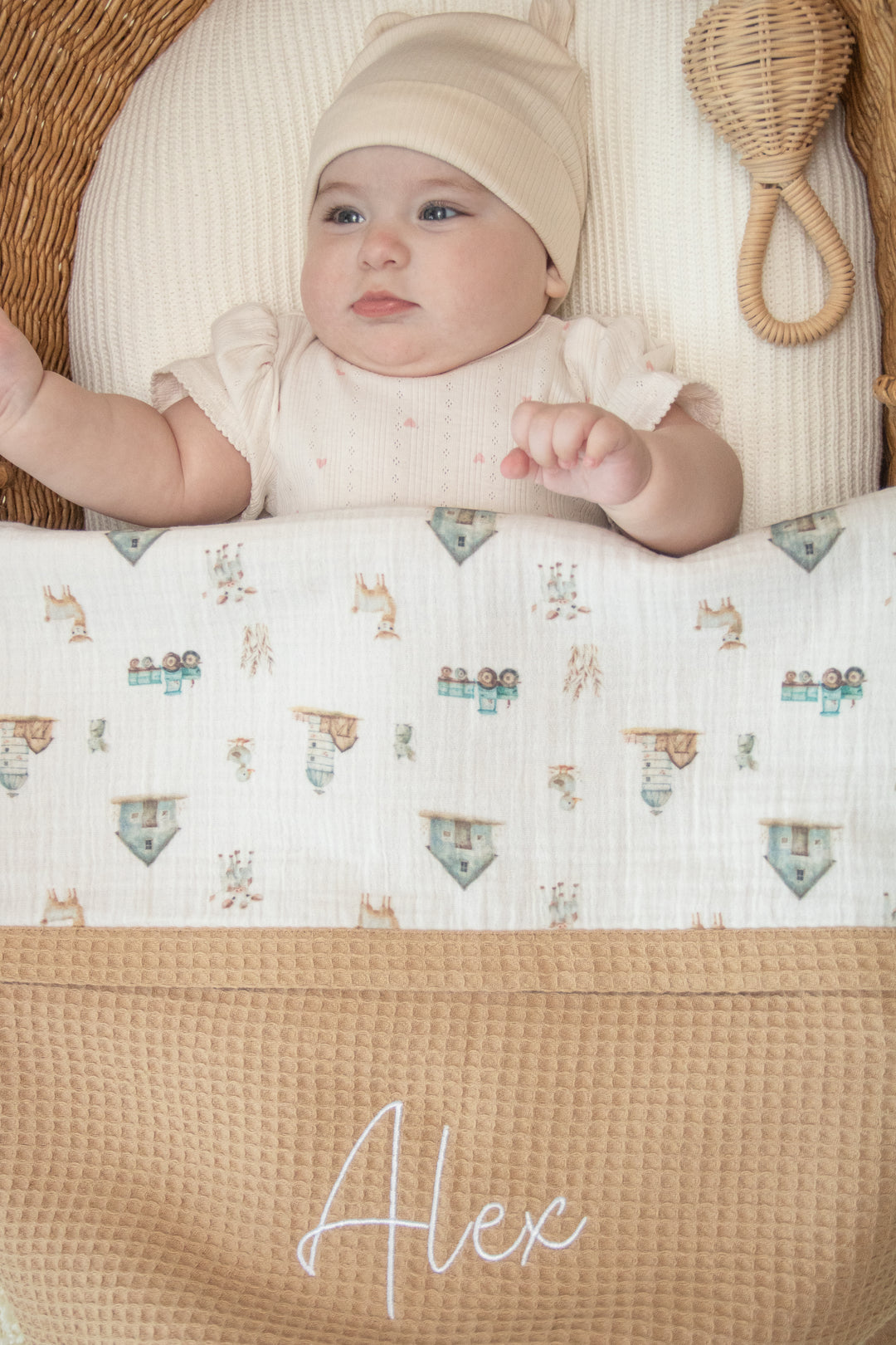 Mouliss close-up of embroidered name on personalized caramel baby blanket with animal muslin