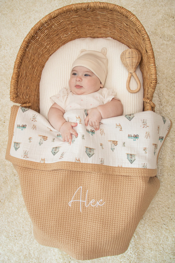 Mouliss baby in basket with personalized caramel waffle baby blanket, animal muslin, embroidered name