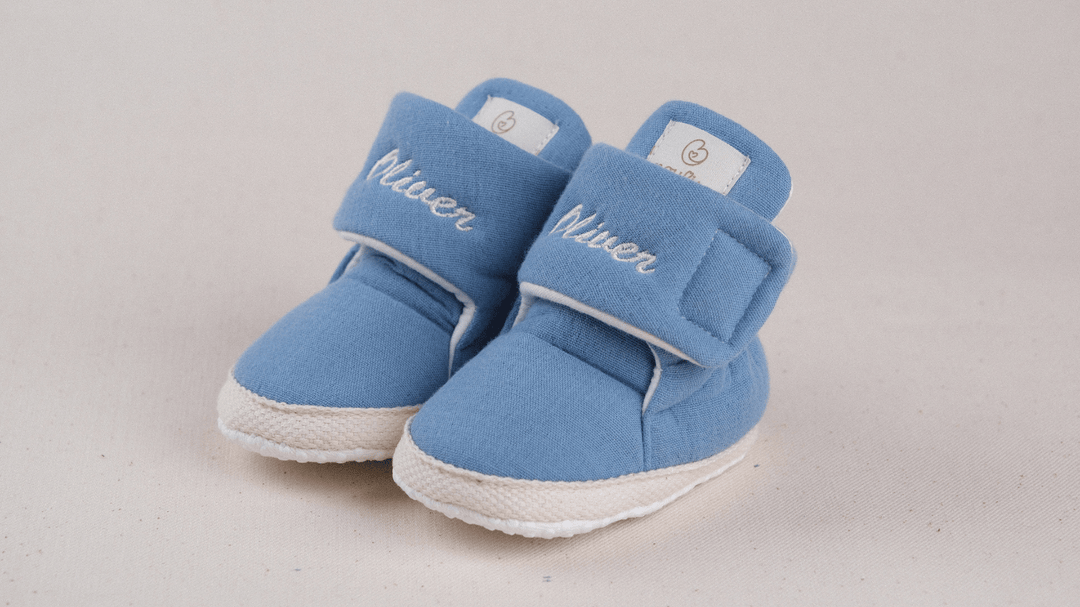 Mouliss Denim Blue muslin personalized baby booties — styling photo 2