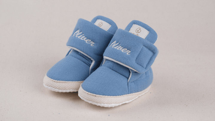 Mouliss Denim Blue muslin personalized baby booties — styling photo 2