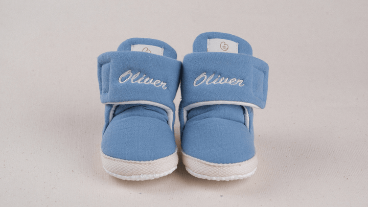 Mouliss Denim Blue muslin personalized baby booties — styling photo 1