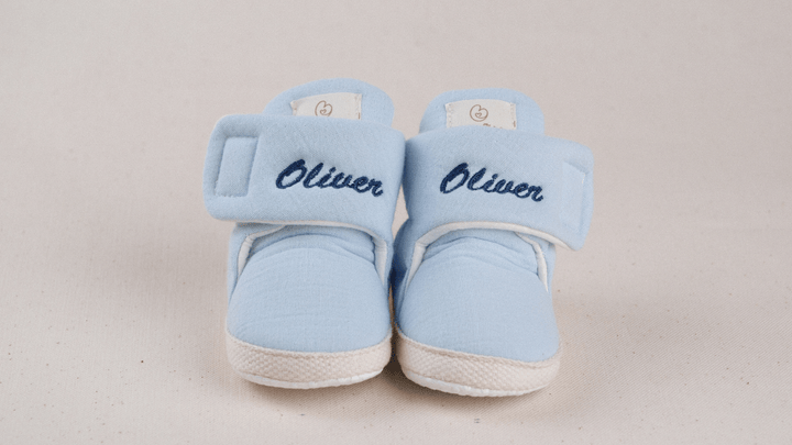 Mouliss Light Blue muslin personalized baby booties — styling photo 1