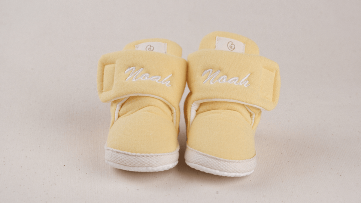 Mouliss Yellow muslin personalized baby booties — styling photo 1