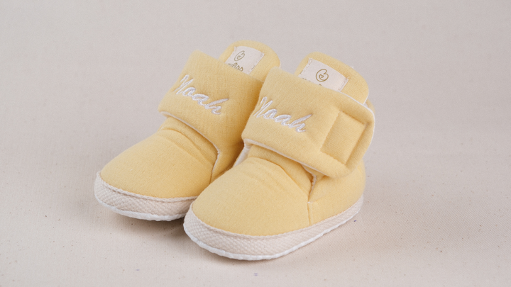 Mouliss Yellow muslin personalized baby booties — styling photo 2