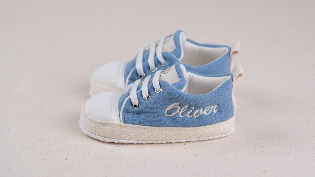 Mouliss personalized denim blue baby shoes with embroidered name, side studio shot