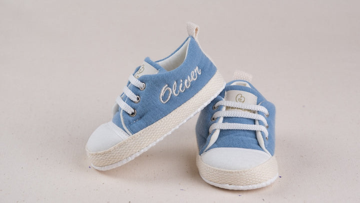 Mouliss personalized denim blue baby shoes with embroidered name, stacked studio shot