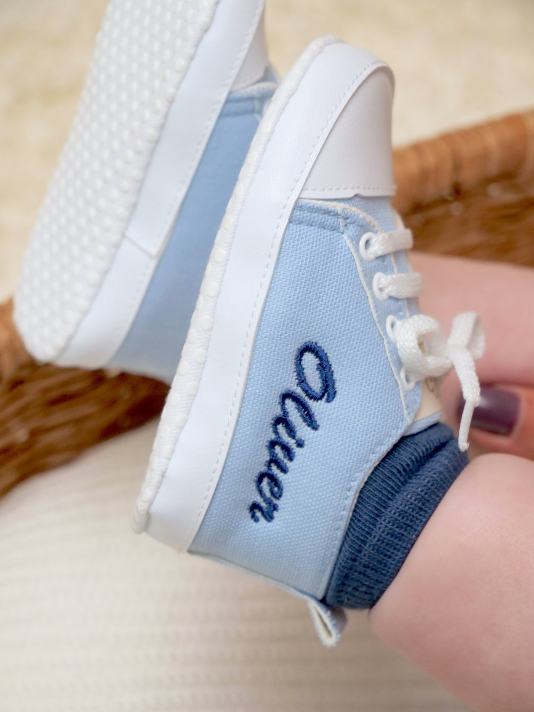 Mouliss personalized light blue baby sneakers with embroidered name, worn by baby