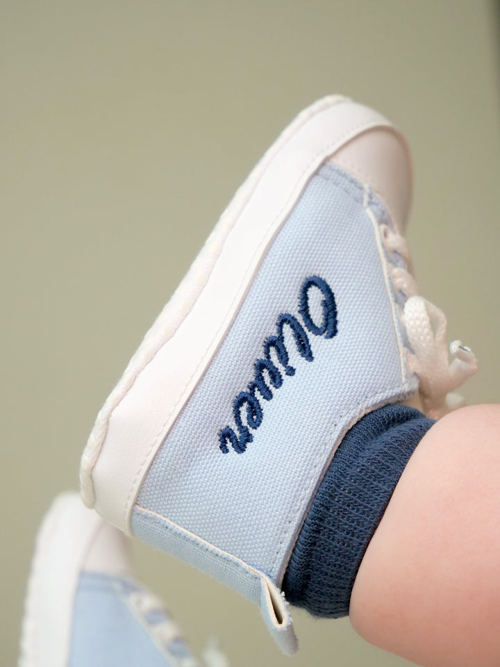 Mouliss embroidered name detail on light blue canvas baby shoes