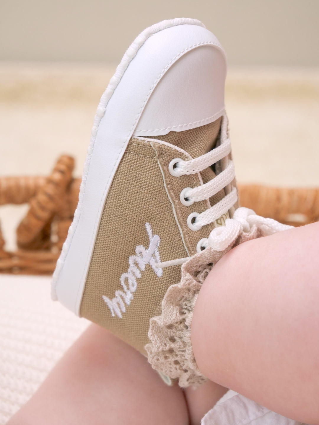 Mouliss personalized beige canvas baby shoes with embroidered name, worn by baby