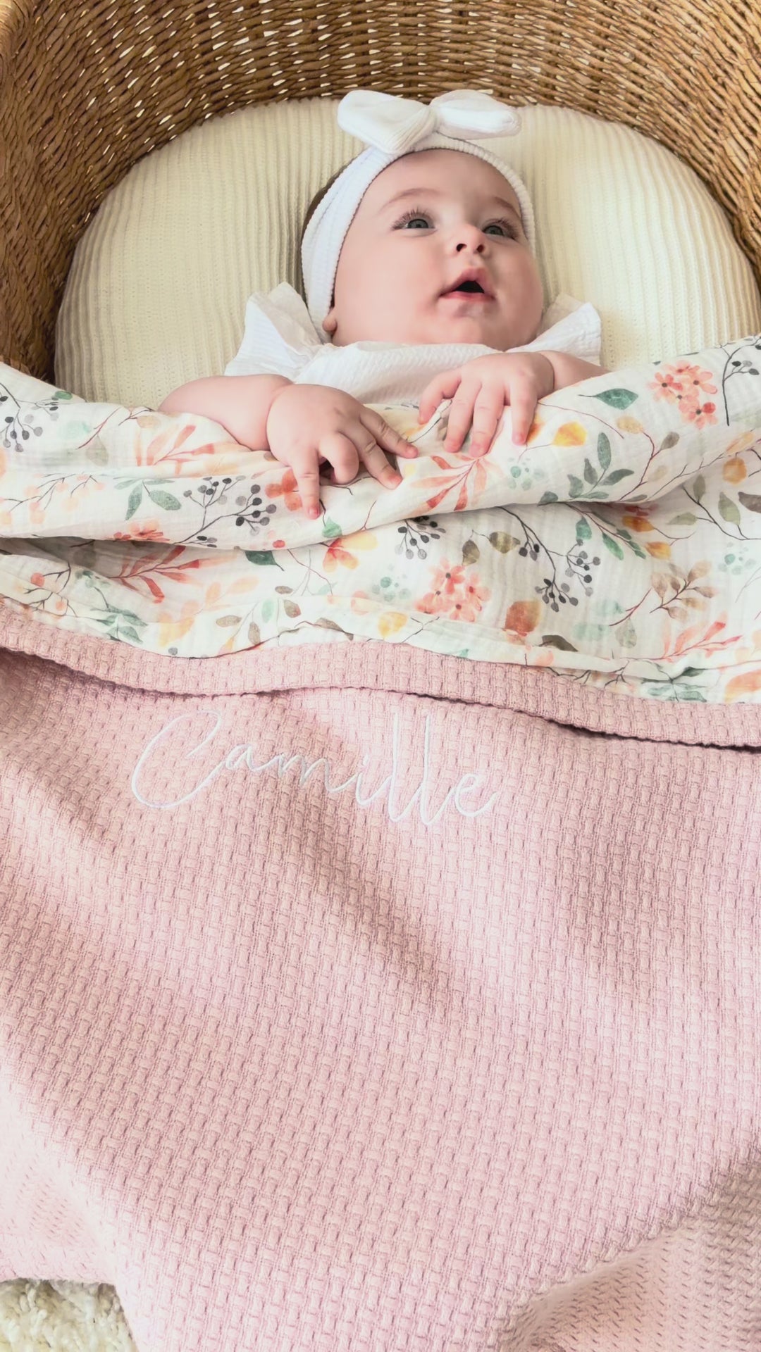 Mouliss personalized pink baby blanket with floral muslin, embroidered name, shown in basket